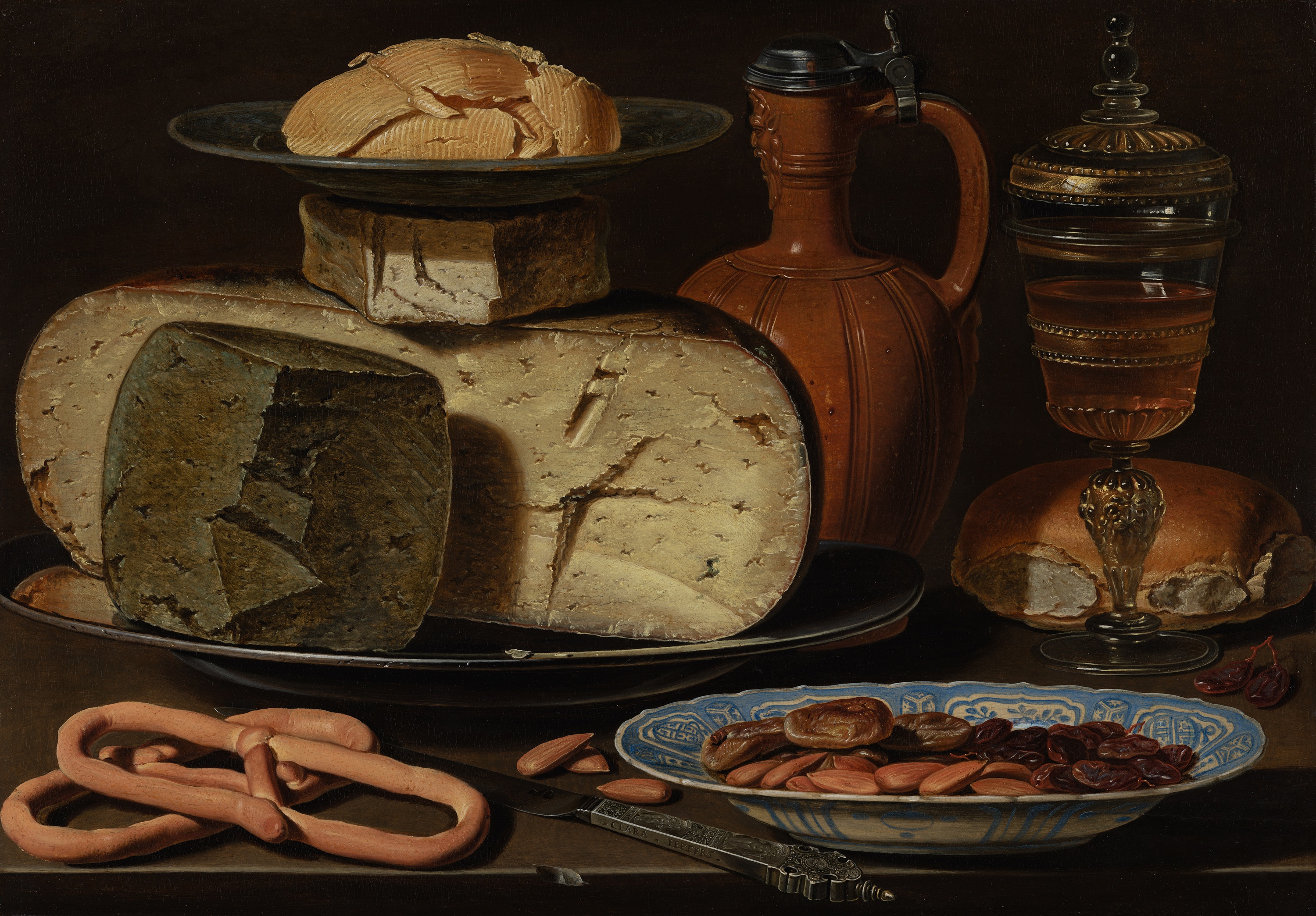 Still Life with Cheeses, Almonds and Pretzels by Clara Peeters - c. 1615 - 35 x 50 cm Mauritshuis, The Hague