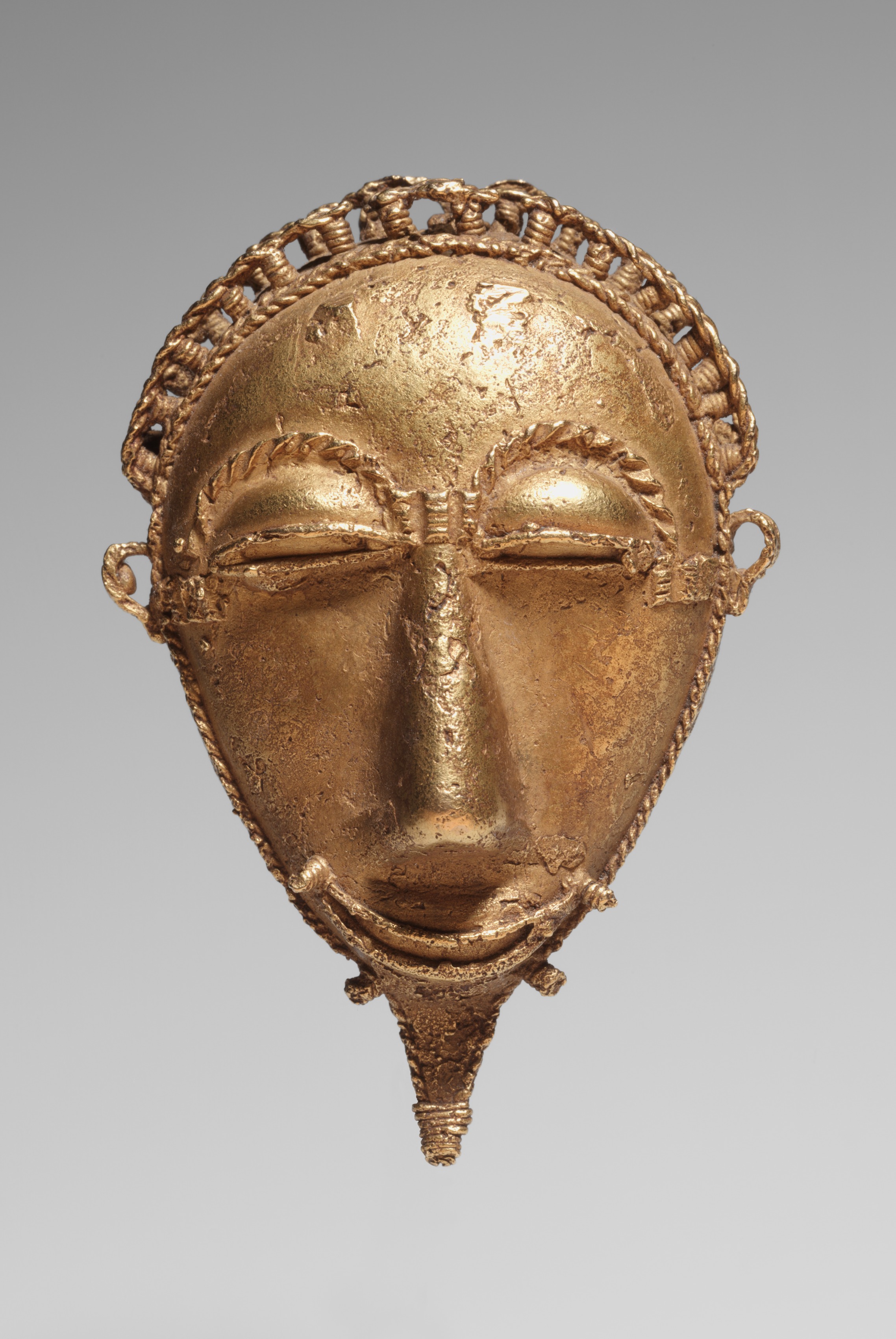 Pendant: Face by Unknown Artist - 1900 - 7.6 x 5 cm Cleveland Museum of Art