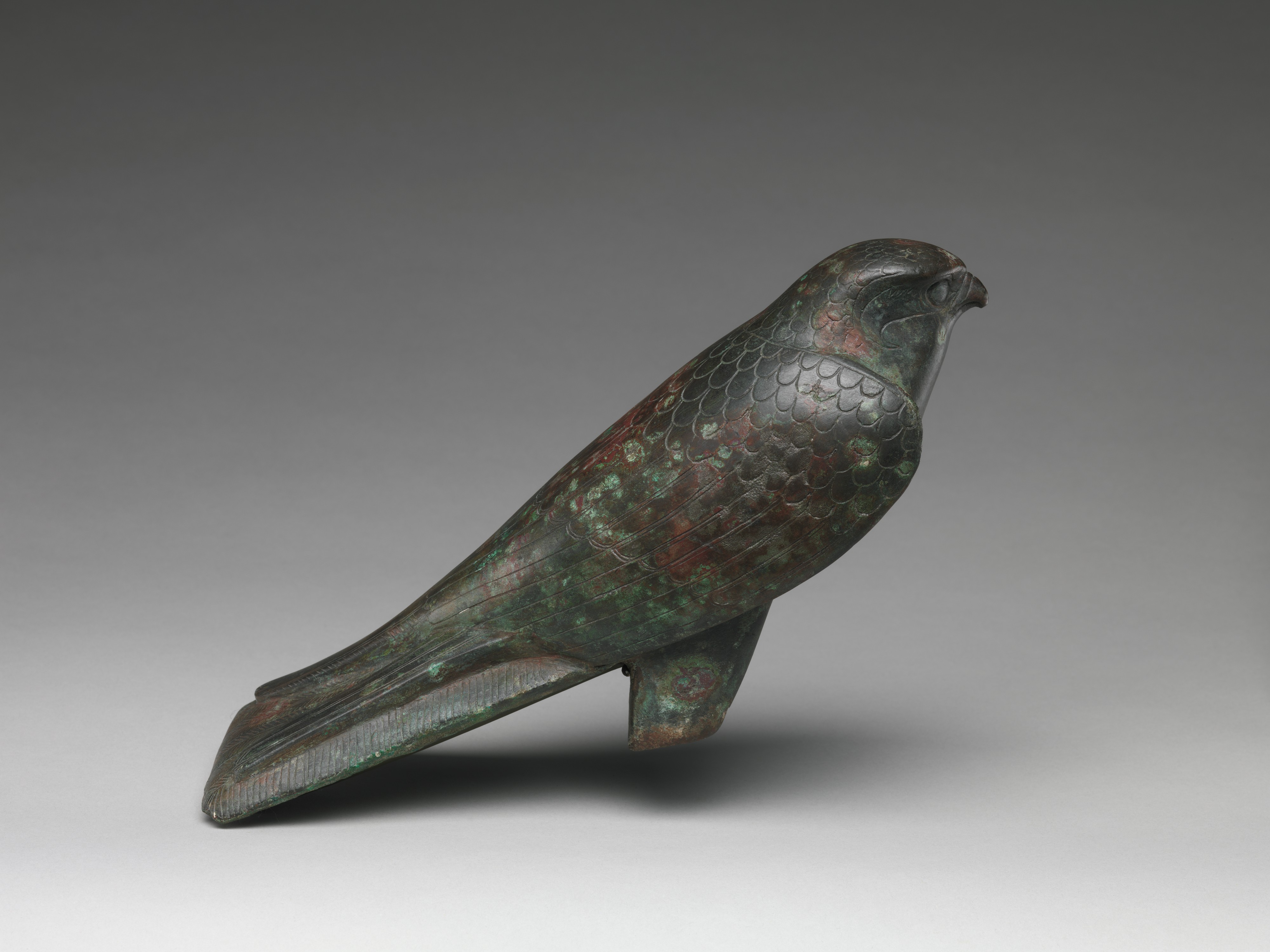 Falcon statue serving as a sarcophagus for a sacred animal by Unknown Artist - 664–30 B.C. - 23.2 x 3.3 x 18.1 cm Metropolitan Museum of Art