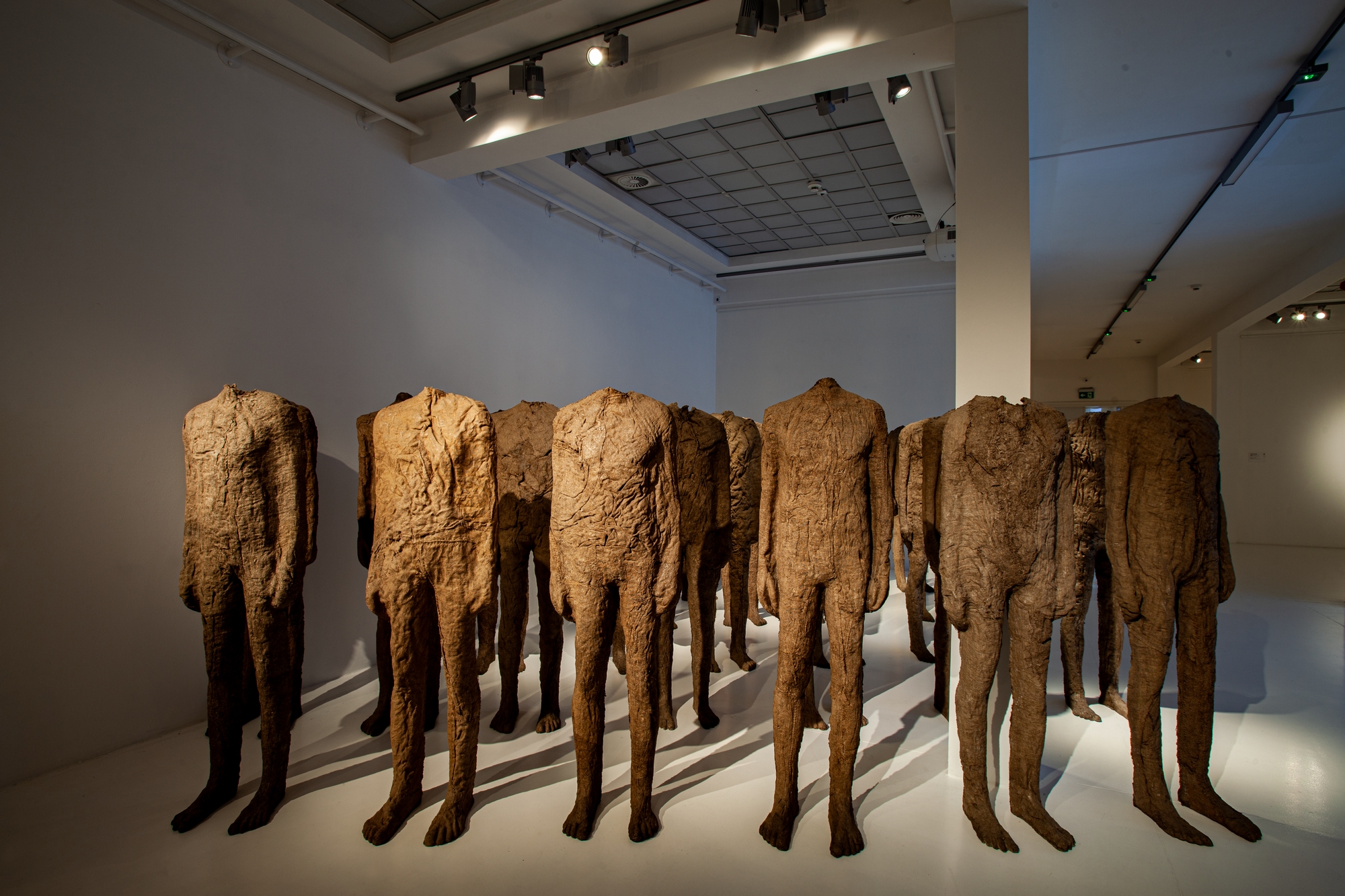 The Crowd by Magdalena Abakanowicz - 1986–1994 - 175 × 85 × 30 cm and 175 × 60 × 30 cm The National Museum in Wrocław
