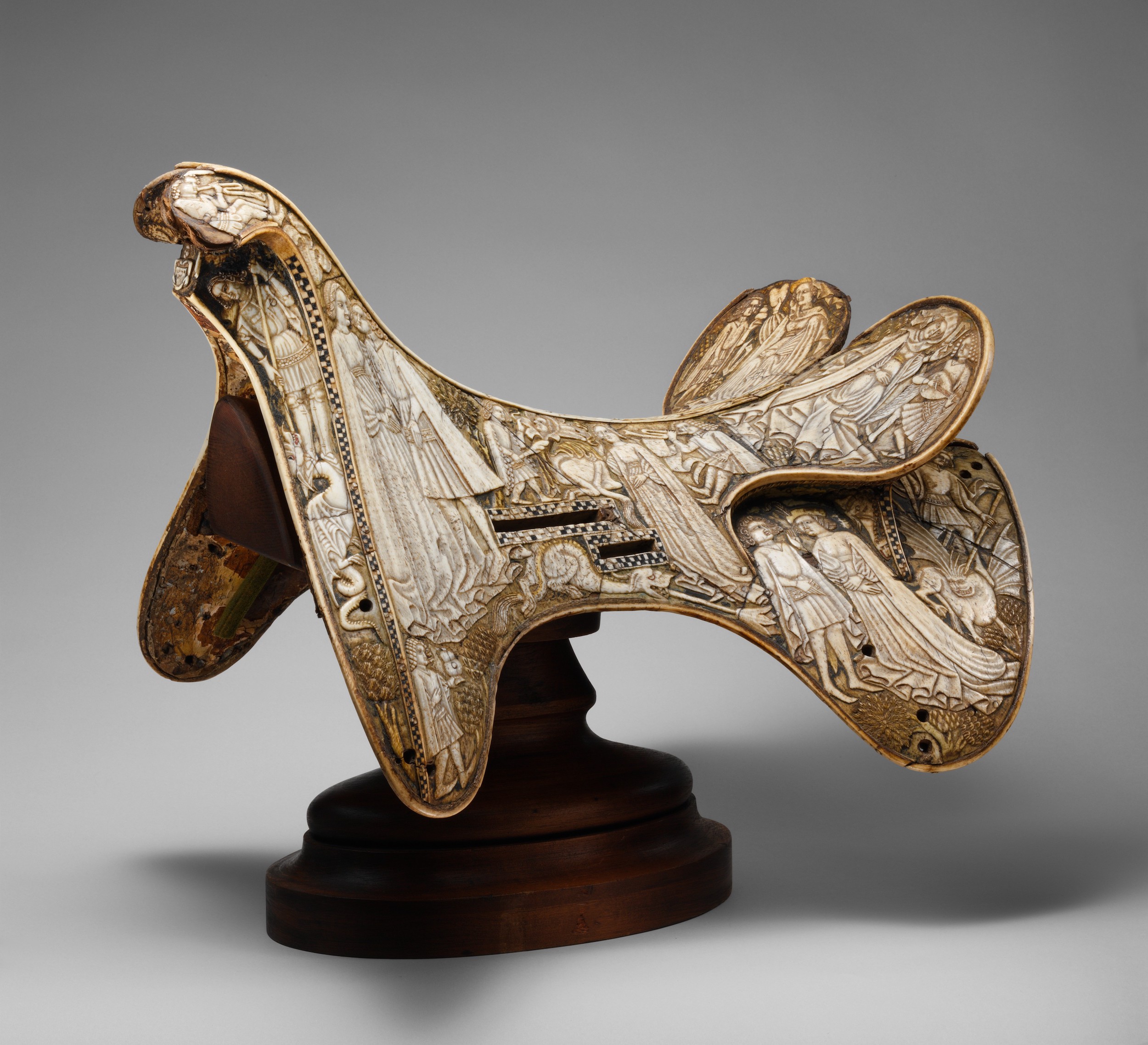 Saddle by Unknown Artist - c. 1400–1420 - 33.8 × 52.1 × 34.6 cm Metropolitan Museum of Art